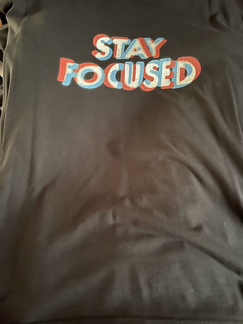 T-shirt saying 'Stay Focused' in out of focus text